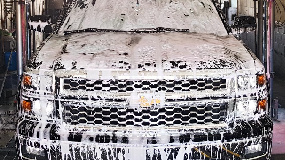 Clean truck grille at Pico Rivera Car Wash